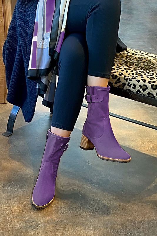 Amethyst purple women's ankle boots with buckles on the sides. Round toe. Medium block heels. Worn view - Florence KOOIJMAN